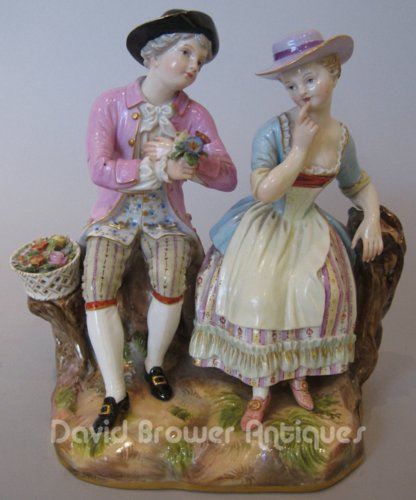 Meissen group a boy offering flowers to a girl