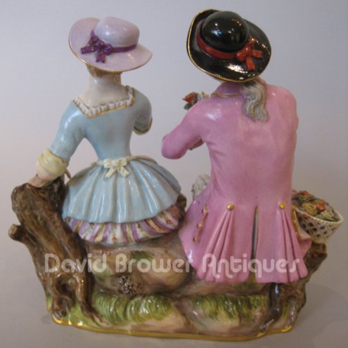 Meissen group a boy offering flowers to a girl