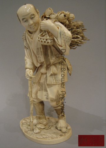 A Large Japanese Ivory Okimono of a woodcutter