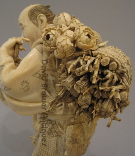 A Large Japanese Ivory Okimono of a woodcutter