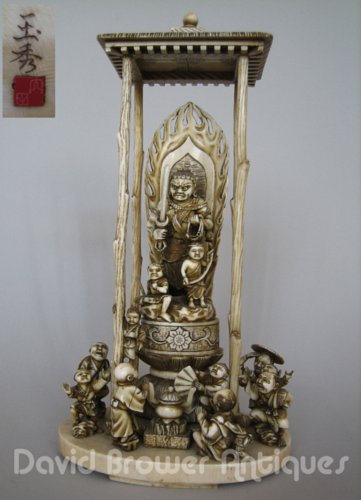 Japanese Ivory group of people around a shrine