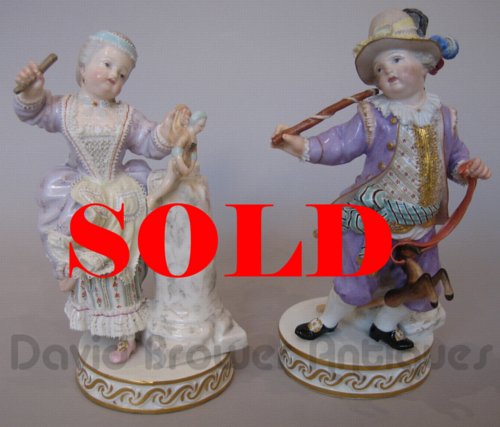 Pair of Meissen Figures, girl with a doll and boy with hobby horse