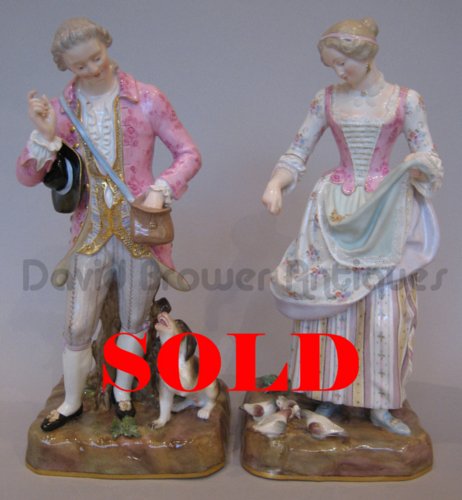 Pair of Meissen figures depicting a couple feeding a dog and some doves