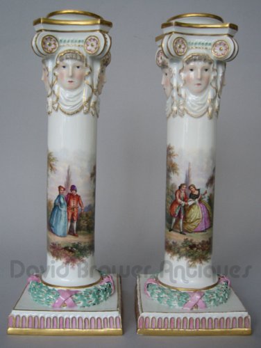 A pair of Meissen candlesticks with liners