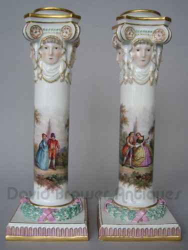 A pair of Meissen candlesticks with liners