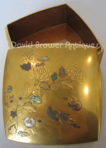 A superb Japanese gold lacquer box of flowers and doves