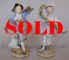 Pair of Meissen figures of a gallant and companion with floral garlands