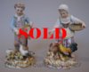 Pair of Meissen figures of a boy and girl feeding farmyard fowl