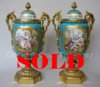 Pair of ormolu mounted Sevres vases